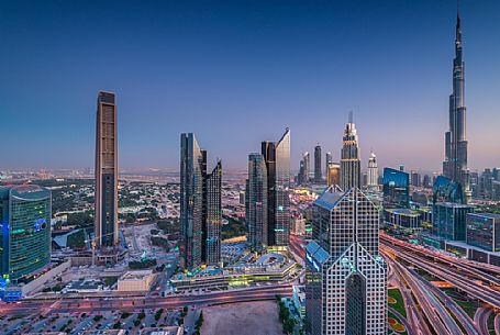 Burj Khalifa and High Rises on Sheikh Zayed Road at twilight, Downtown Dubai, Emirate of Dubai, UAE, Asia