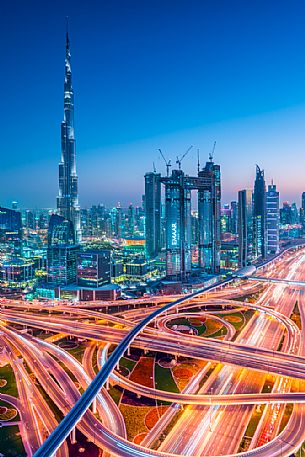 Burj Khalifa and High Rises on Sheikh Zayed Road at twilight, Downtown Dubai, Emirate of Dubai, UAE, Asia