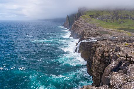 The wild Bsdalafossur waterfall flows from the lake Leitisvatn or Srvgsvatn into the Atlantic ocean, Vgar Island (Vg), Faeroe Islands, Denmark, Europe