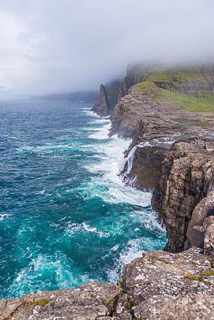 The wild Bsdalafossur waterfall flows from the lake Leitisvatn or Srvgsvatn into the Atlantic ocean, Vgar Island (Vg), Faeroe Islands, Denmark, Europe