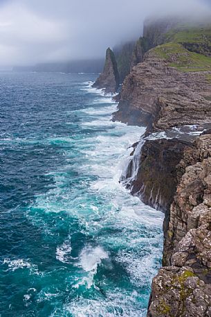 The wild Bsdalafossur waterfall flows from the lake Leitisvatn or Srvgsvatn into the Atlantic ocean, Vgar Island (Vg), Faeroe Islands, Denmark, Europe