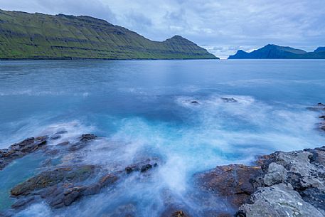 Wild seascape near Elduvík village, Funningsfjørður, Eysturoy Island, Faeroe islands, Denmark, Europe