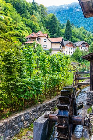 Old watermill and typical houses in the village of Kropa, Radovljica, Slovenia, Europe