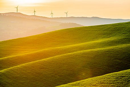 Wind turbines in the typical Tuscan landscape near Volterra, Tuscany, Italy, Europe