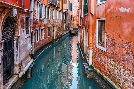 Tourists in the gondola in Venice's canal, Venice, Veneto, Italy, Europe