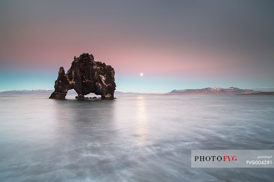 Hvitserkur rock formation and full moon rise Hvitserkur rock formation and full moon rise