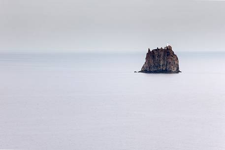 The rock of Strombolicchio, and its lighthouse, seen from Stromboli.