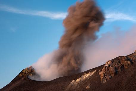 An explosion produces a coloumn of smoke.