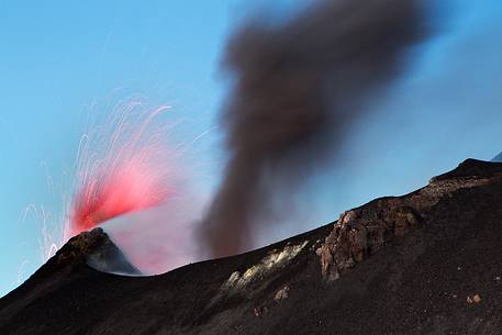 An explosion produces a coloumn of smoke.